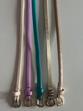 Slim belts in cream, pink, teal, gold, and rose gold